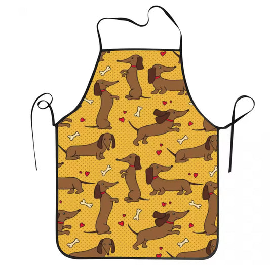 Tablier de cuisine motif teckel en polyester jaune avec petits chiens imprimés