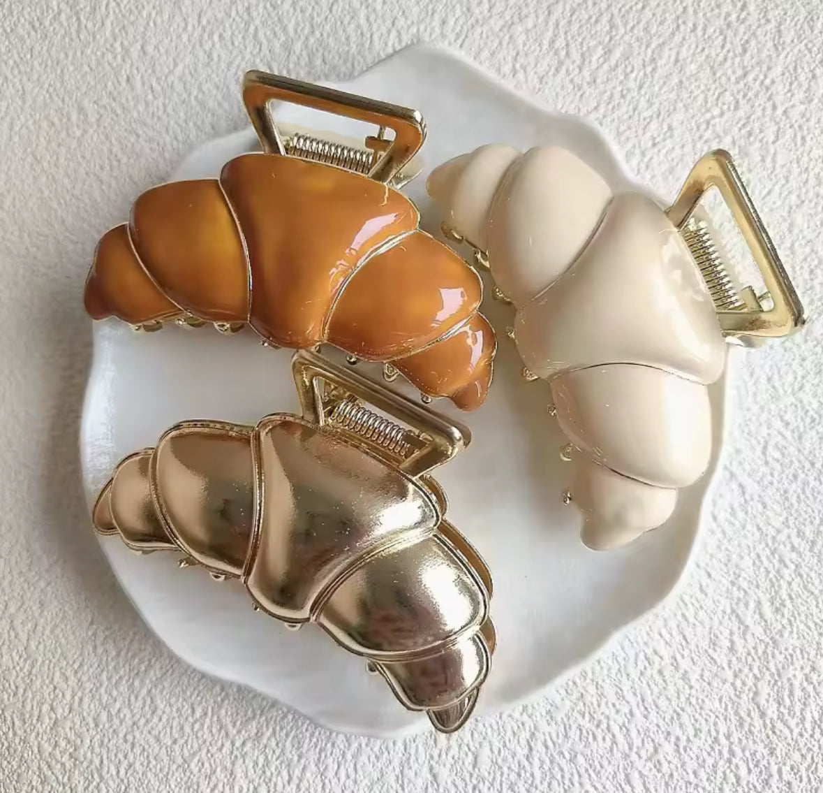 Accessoire pour cheveux en forme de croissant doré brillants
